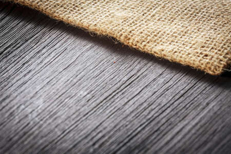 Burlap texture on wooden table backgroundの写真素材