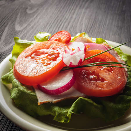 salad with red and yellow peppers and lettuce, food の写真素材