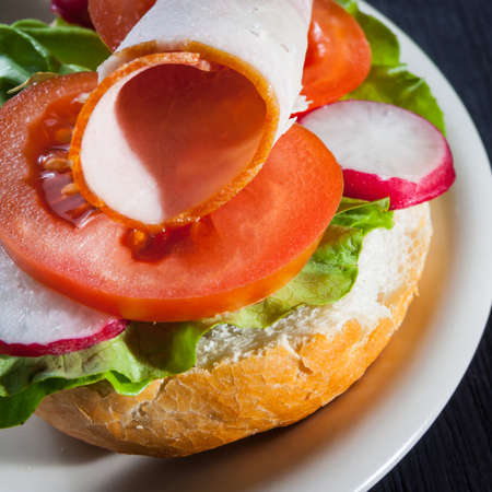 Ham, salad submarine sandwich from freshly cut baguetteの写真素材
