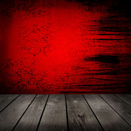 Old room with red wall and wooden floorの写真素材