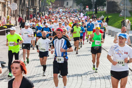 KRAKOW, POLAND - MAY 18 : Cracovia Marathon. Runners on the city streets on May 18, 2014 in Krakow, POLAND のeditorial素材
