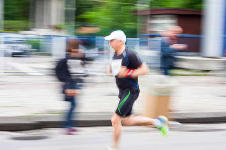 KRAKOW, POLAND - MAY 18 : Cracovia Marathon. Runners on the city streets on May 18, 2014 in Krakow, POLAND のeditorial素材