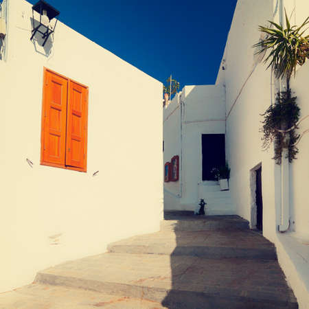 vintage photo of narrow street in Lindos. Rhodes, Greece の写真素材