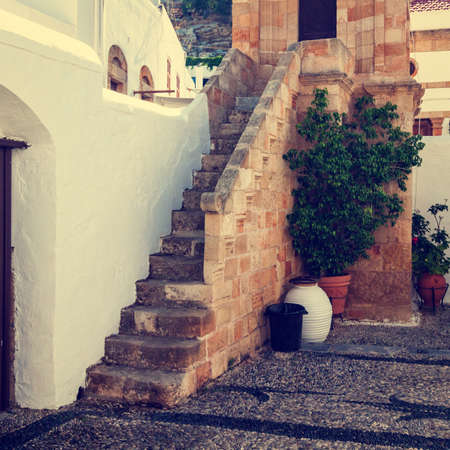 vintage photo of narrow street in Lindos. Rhodes, Greece の写真素材