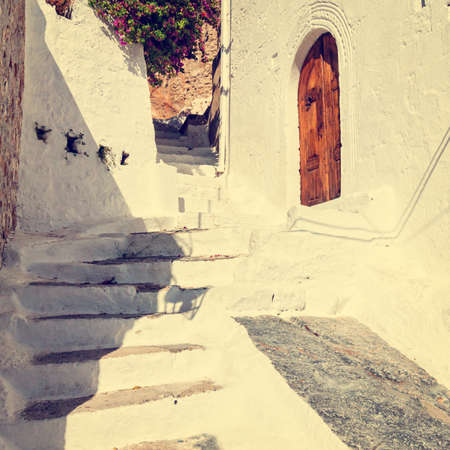 vintage photo of narrow street in Lindos. Rhodes, Greece の写真素材