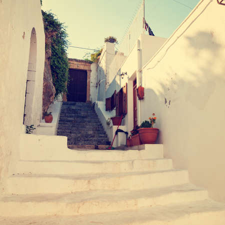 vintage photo of narrow street in Lindos. Rhodes, Greece の写真素材