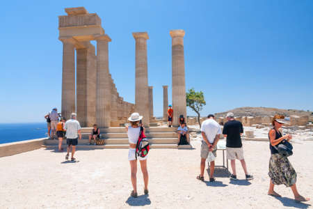 LINDOS, GREECE - JUNE 24: Unidentified tourists walking in historic town Lindos on June 24, 2008....