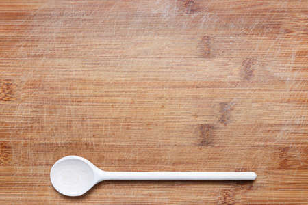 wooden cutlery on cutting boardの写真素材