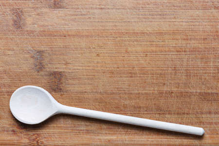 wooden cutlery on cutting boardの写真素材