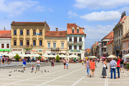 BRASOV, ROMANIA - JULY 15: Council Square on July 15, 2014 in Brasov, Romania. Brasov is known for its Old Town, which is a major tourist attraction includes the Black Church, Council Square and medieval buildings. のeditorial素材