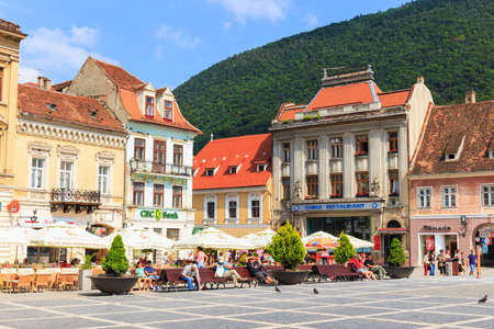BRASOV, ROMANIA - JULY 15: Council Square on July 15, 2014 in Brasov, Romania. Brasov is known for its Old Town, which is a major tourist attraction includes the Black Church, Council Square and medieval buildings. のeditorial素材