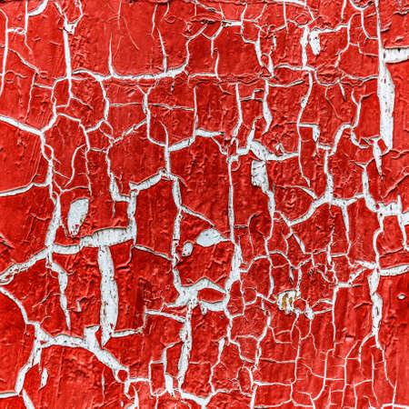 cracked paint on the concrete wall の写真素材