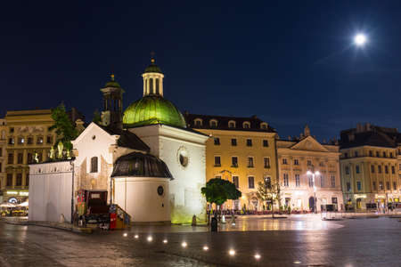 KRAKOW, POLAND - October 09 2014: The single-nave building of Church of St. Wojciech in the Market Square, built in the Romanesque style, Krakow, Poland October 09 2014のeditorial素材