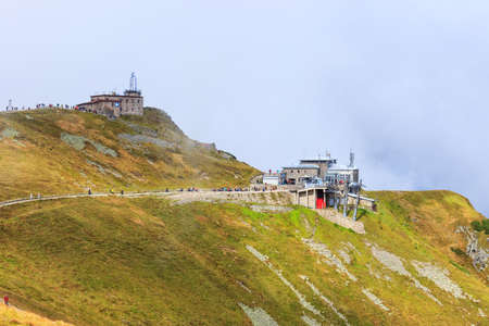 Zakopane, POLAND - September 13: Group of tourists walk to the top of the Kasprowy Wierch in Tatra Mountains on September 13, 2014 in Tatra Mountains, Poland.のeditorial素材