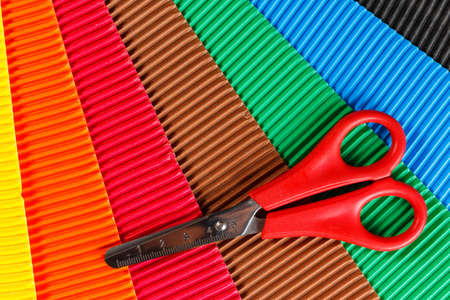 scissors on colorful cardboardの写真素材