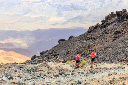 El Teide, Tenerife, June 06, 2015: Unidentified people runs from the top of El Teide Volcano, Tenerife, Spainのeditorial素材