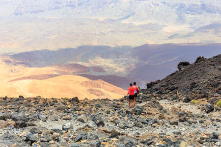 El Teide, Tenerife, June 06, 2015: Unidentified people runs from the top of El Teide Volcano, Tenerife, Spainのeditorial素材