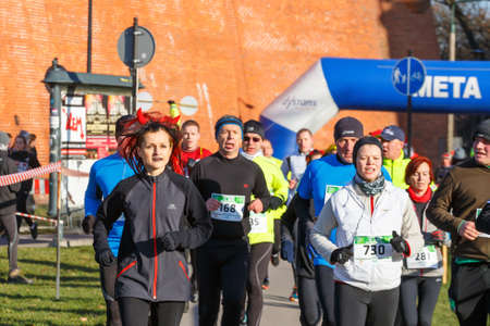 Krakow, Poland - December 31, 2015: 12th New Year's Eve Race in Krakow. The people running dressed...