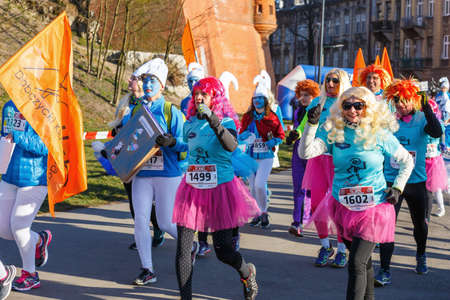 Krakow, Poland - December 31, 2015: 12th New Year's Eve Race in Krakow. The people running dressed...