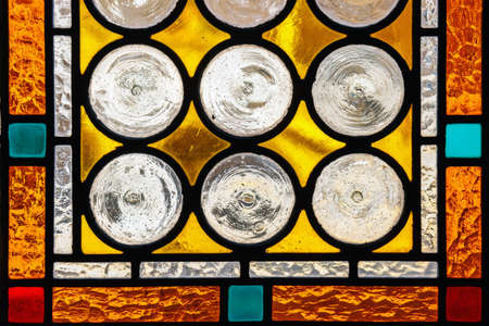 multicolored stained glass window with circural blocksのeditorial素材