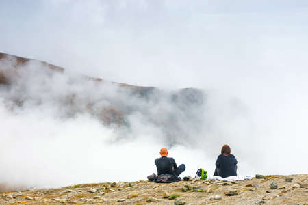 Tourists walking in a foggy day to the top of the Kasprowy Wierch in Tatra Mountains on October 10, 2015, Poland.の写真素材