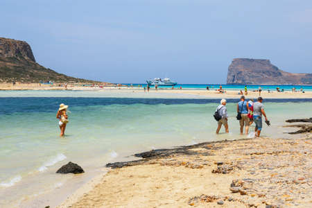 Crete, Greece - 24 May, 2016: Unidentified people sunbathing and strolling along the beach in Balos Lagoon on Crete, Greeceのeditorial素材