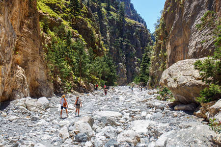 Samaria Gorge, Grece - MAY 26, 2016: Tourists hike in Samaria Gorge in central Crete, Greece. The national park is a UNESCO Biosphere Reserve since 1981のeditorial素材