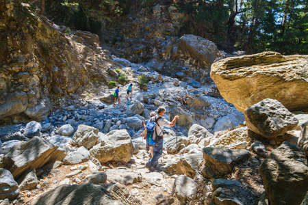 Samaria Gorge, Greece - MAY 26, 2016: Tourists hike in Samaria Gorge in central Crete, Greece. The national park is a UNESCO Biosphere Reserve since 1981のeditorial素材