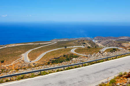 curvy road near Chora Sfakion town on Crete, Greeceの写真素材