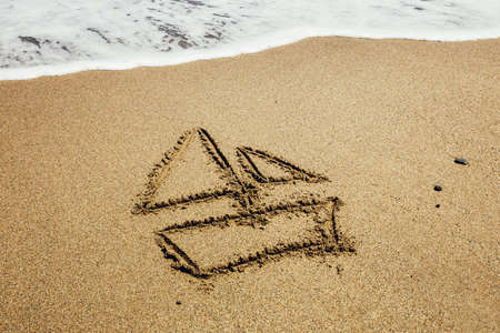 Ship painted on sand beachの写真素材
