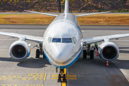 Funchal, Madeira - July 6, 2016: Enter Air Boeing 737 at Funchal Cristiano Ronaldo Airport, boarding passengers.This airport is one of the most dangerous airports in Europeのeditorial素材