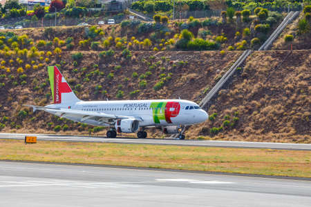 Funchal, Madeira - July 6, 2016: TAP Portugal Airbus A319-111 lands at Funchal Cristiano Ronaldo...