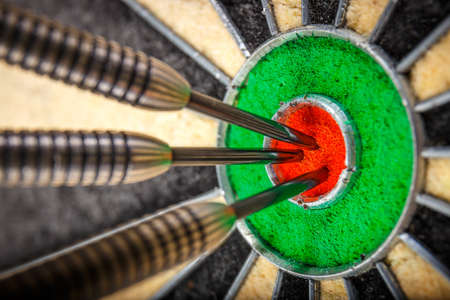 three darts in bull's eye, close upの写真素材