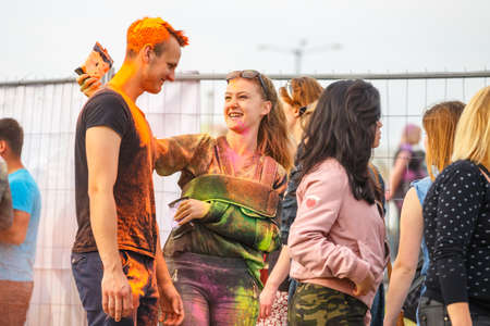 Krakow, Poland, 11 June, 2016: Festival of Colors in Krakow. Unidentified people dancing and...
