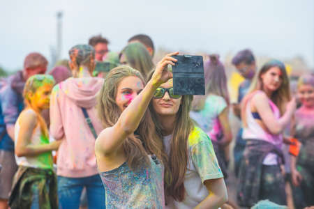 Krakow, Poland, 11 June, 2016: Festival of Colors in Krakow. Unidentified people dancing and...