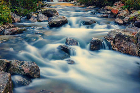 beautiful waterfall in forest, Tatras Mountains, Polandの写真素材