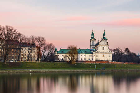 Church on the Skalka in old town in Krakow with reflection in the river, Poland. Long time exposure