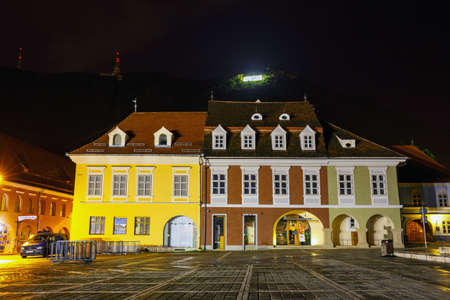 BRASOV, ROMANIA - JULY 19: Night view of Council Square on July 15, 2014 in Brasov, Romania. Brasov is known for its Old Town, which is a major tourist attractionのeditorial素材