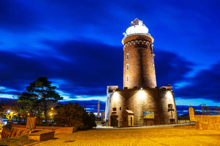 Night view of harbor and the lighthouse in Kolobrzeg, West Pomerania, Polandの写真素材
