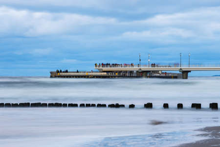 Concrete pier in Kolobrzeg, long exposure shot at sunsetの写真素材