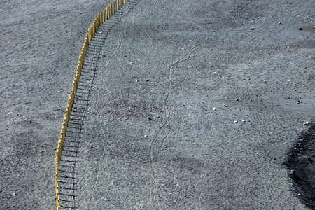 Wooden fence on an El Golfo beach in Lanzaroteの写真素材