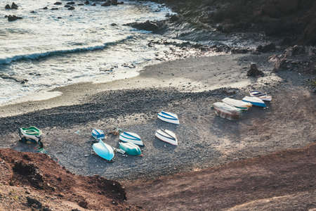 Green Lagoon at El Golfo with fishing boats on the beach, Lanzarote Island, Spainの写真素材