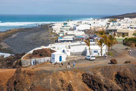 LANZAROTE, SPAIN - March 30, 2017: Unidentified people walking  in El Golfo and Green Lagoon. The Gulf is a lagoon in a volcanic crater surrounded by steep cliffs.のeditorial素材