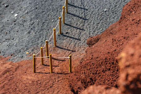 Wooden fence on an El Golfo beach in Lanzaroteの写真素材