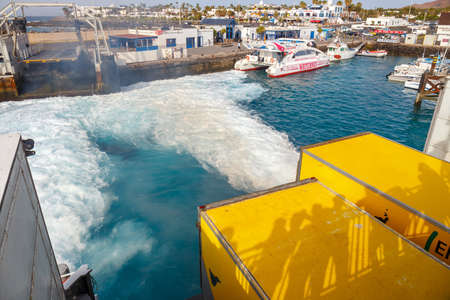 Playa Blanca, Lanzarote, 01 April, 2017: Top view of vehicle and passenger ferry.  The ferry runs several times a day between Lanzarote and Fuerteventura Islandのeditorial素材