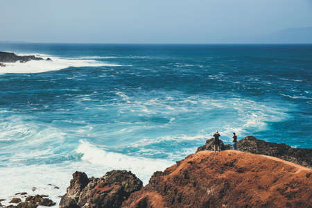 LANZAROTE, SPAIN - March 30, 2017: Unidentified people walking  in El Golfo and Green Lagoon. The Gulf is a lagoon in a volcanic crater surrounded by steep cliffs.のeditorial素材