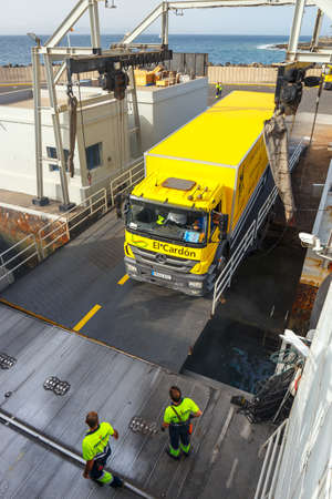 Playa Blanca, Lanzarote, 01 April, 2017: Top view of vehicle and passenger ferry.  The ferry runs several times a day between Lanzarote and Fuerteventura Islandのeditorial素材