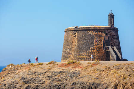 Playa Blanca, Lanzarote, 04 April, 2017: Castle Castillo de las Coloradas on cliff in Playa Blanca, Lanzarote, Canary Islands, Spainのeditorial素材