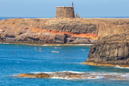 Playa Blanca, Lanzarote, 04 April, 2017: Castle Castillo de las Coloradas on cliff in Playa Blanca, Lanzarote, Canary Islands, Spainの写真素材