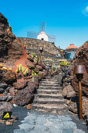 Windmill in tropical cactus garden in Guatiza village, popular attraction in Lanzarote, Canary islandsのeditorial素材